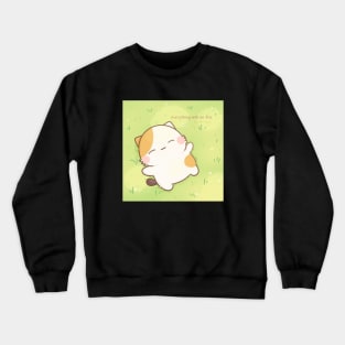 Muffin laying on grass Crewneck Sweatshirt